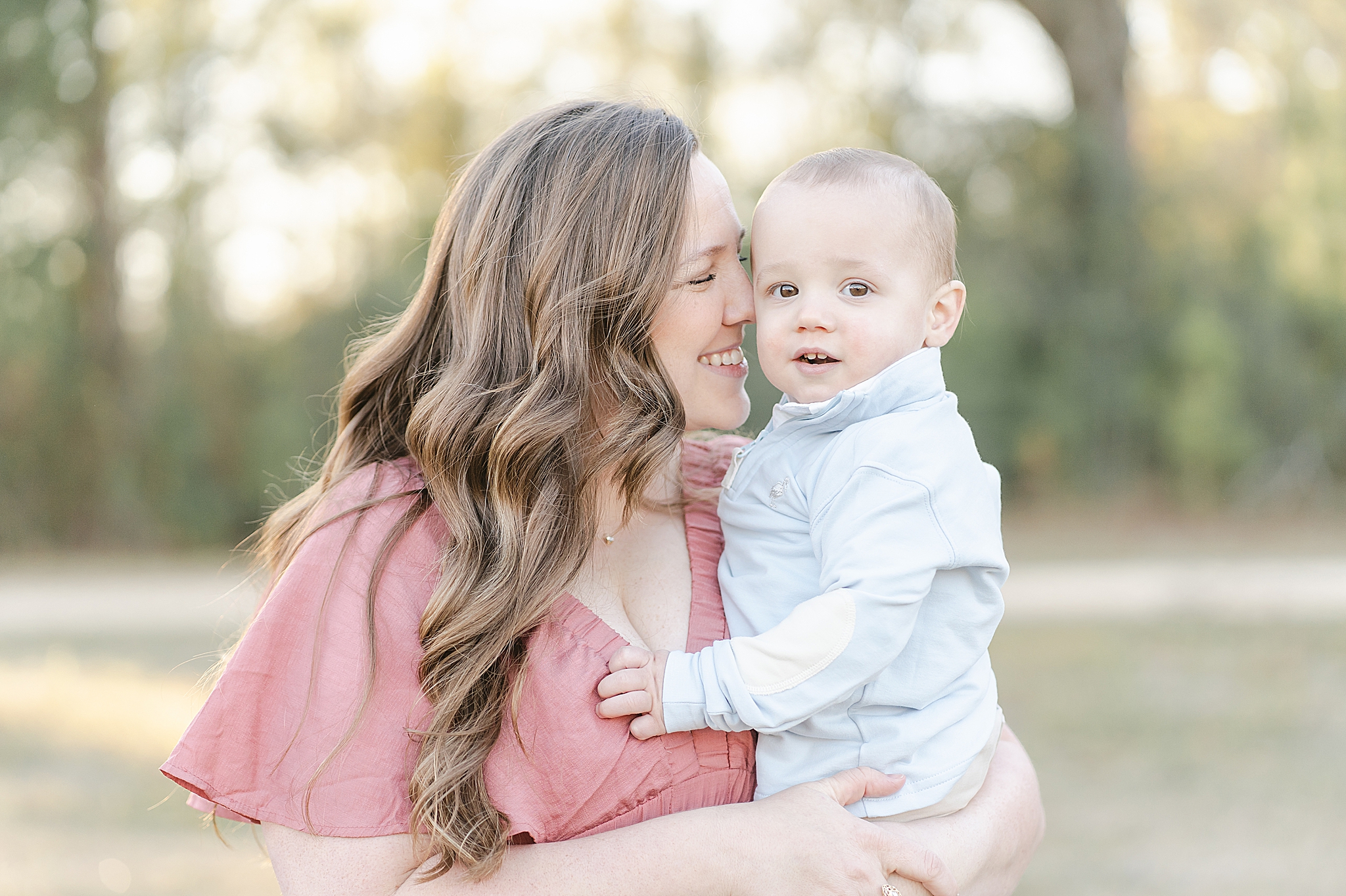 A mom snuggles in with her one year old little boy. Photo by Emily Lofton Photography.